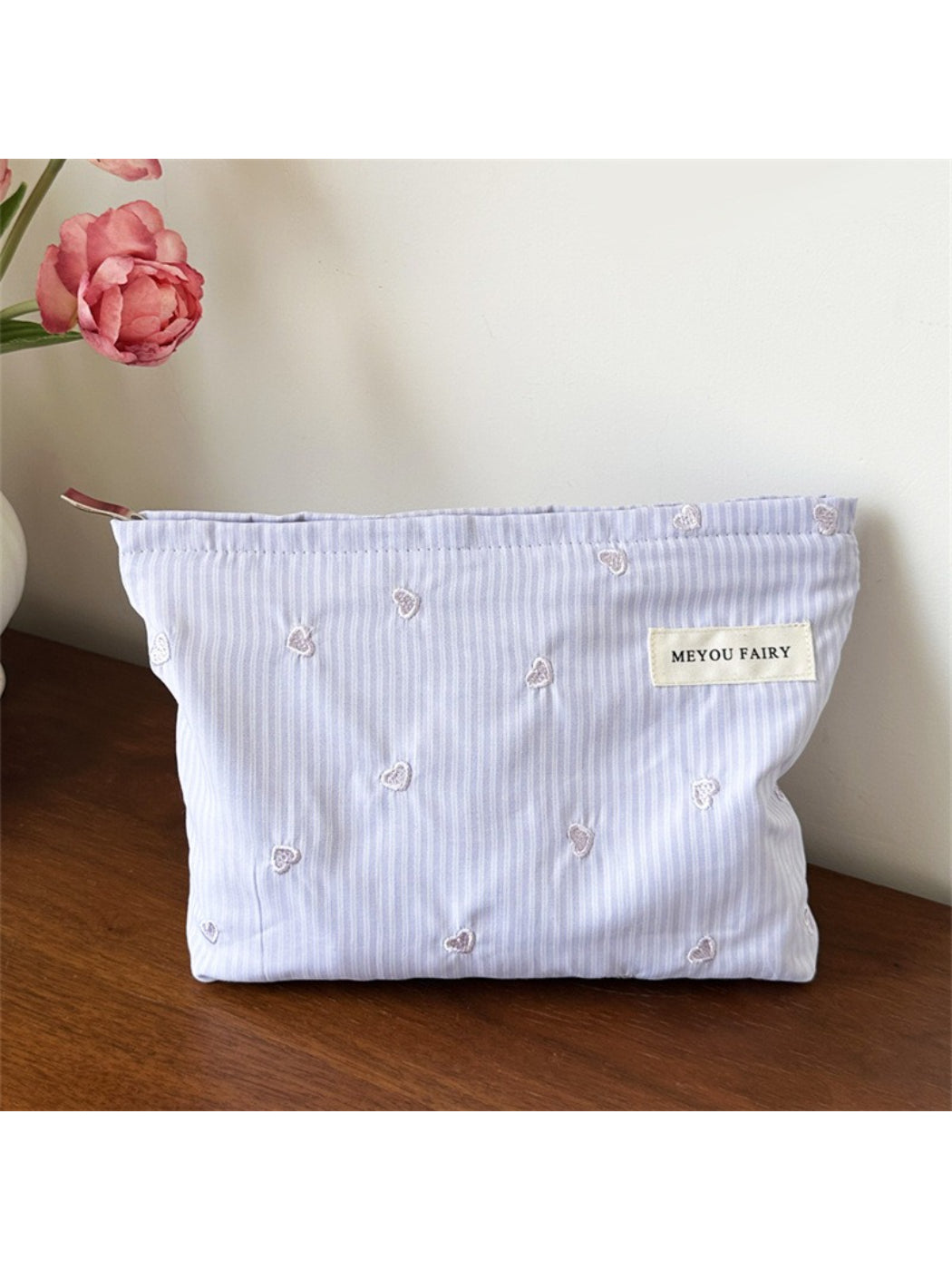 Cosbai makeup organizer bag with cosmetics and brushes inside, demonstrating capacity