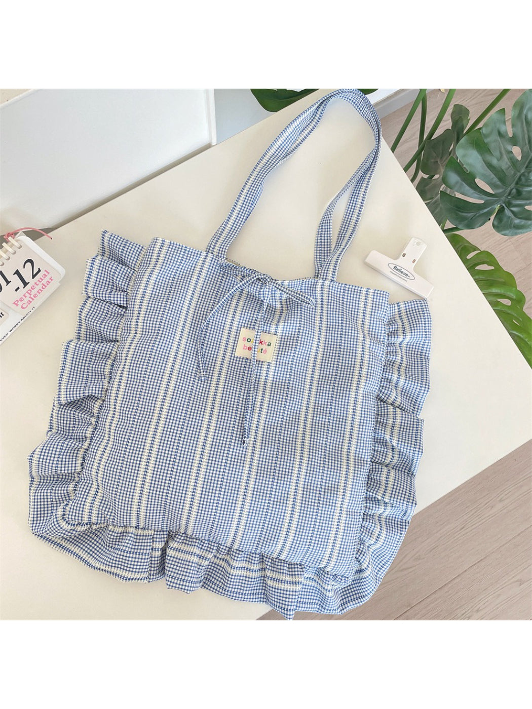 Close-up of Cosbai pastel plaid shoulder tote bag fabric and strap detail