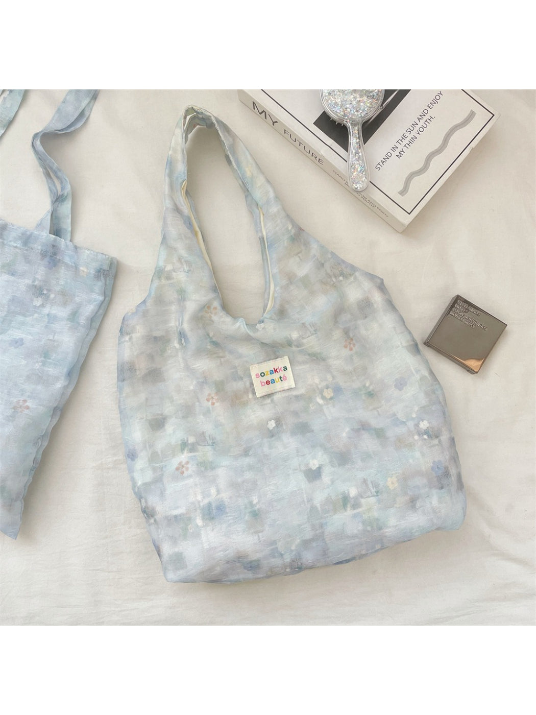 Cosbai sheer floral tote bag styled with casual outfit, highlighting its spacious interior
