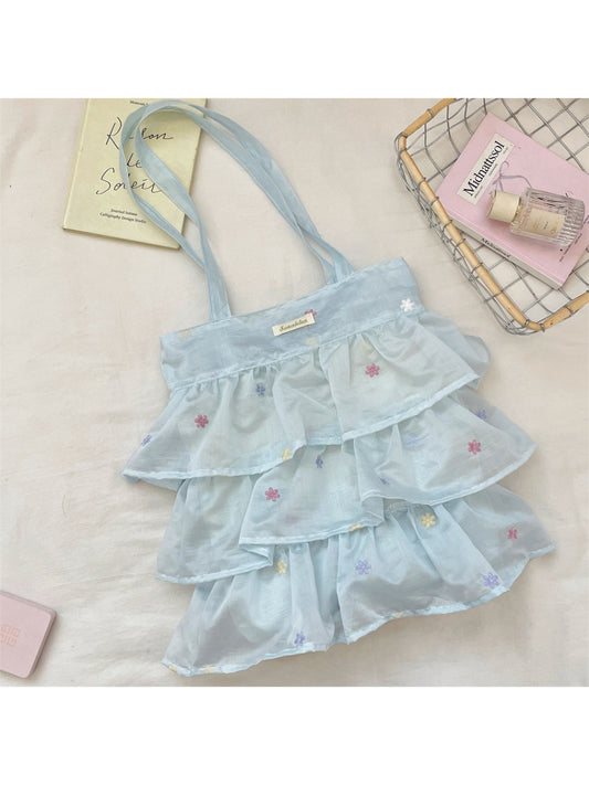 Close-up of pastel mesh fabric and ruffle design on Cosbai tote bag