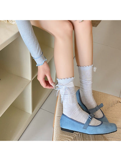 Model wearing Rufia Romantic Ribbon Trim Socks styled with casual shoes