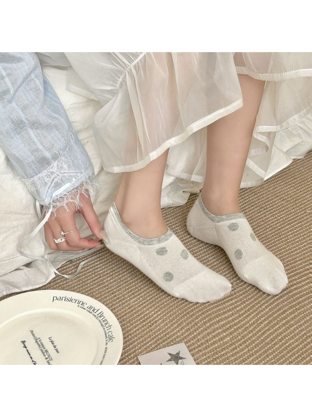 Pair of Rufia puppy print invisible socks displayed flat on white background