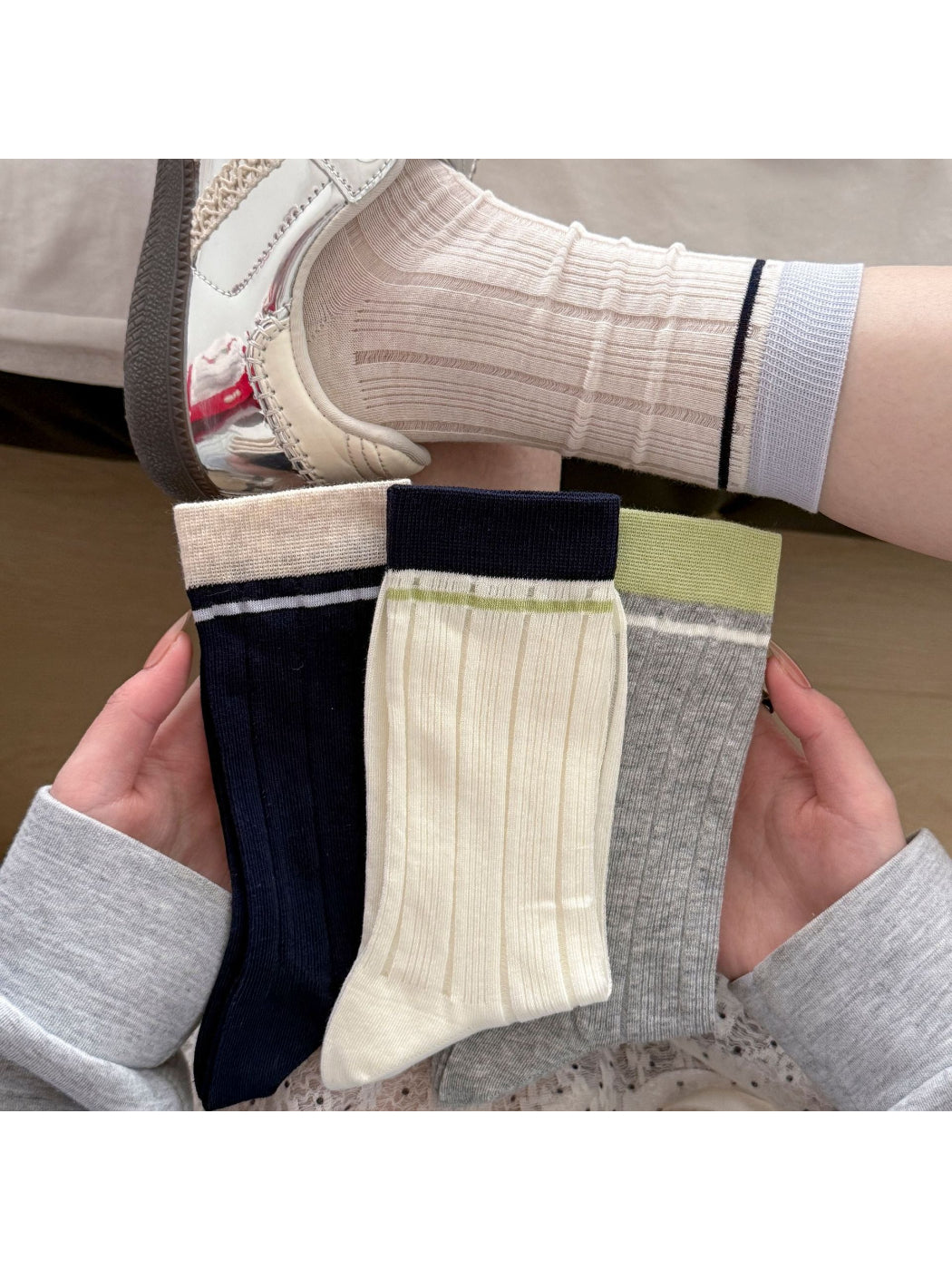 Close-up of Rufia ribbed mesh color block slouch socks showing texture and color contrast