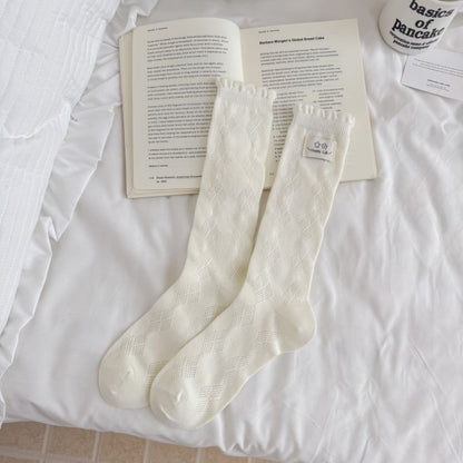 Rufia Fine Stripe Charm Crew Socks paired with casual shoes on a wooden floor