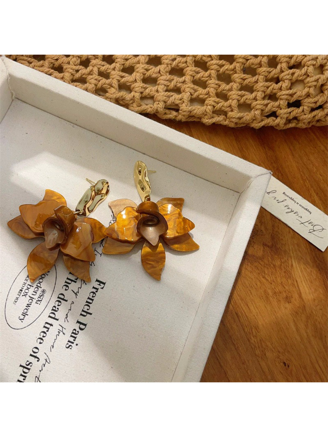 Side view of Earwish artistic floral drop earrings highlighting the drop length