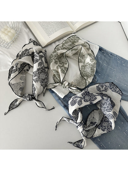 Scarvii elegant neck scarf with intricate lace print in soft neutral tones