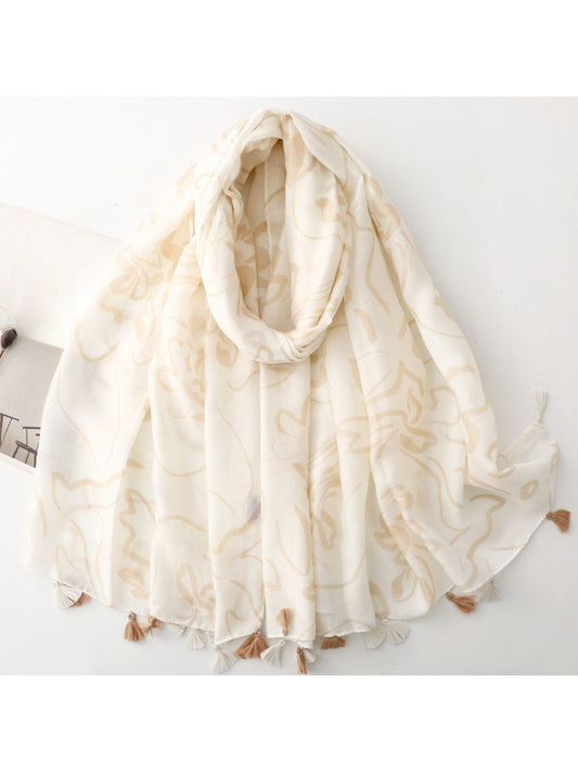 Close-up of floral sketch design on Scarvii tassel scarf in soft pastel colors