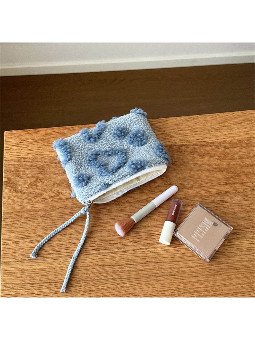 Top view of the plush heart pouch showing and fabric details