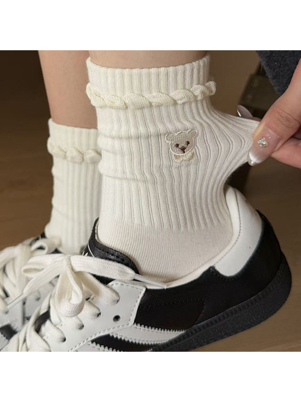 Rufia beige ribbed socks folded showing soft teddy cuff detail