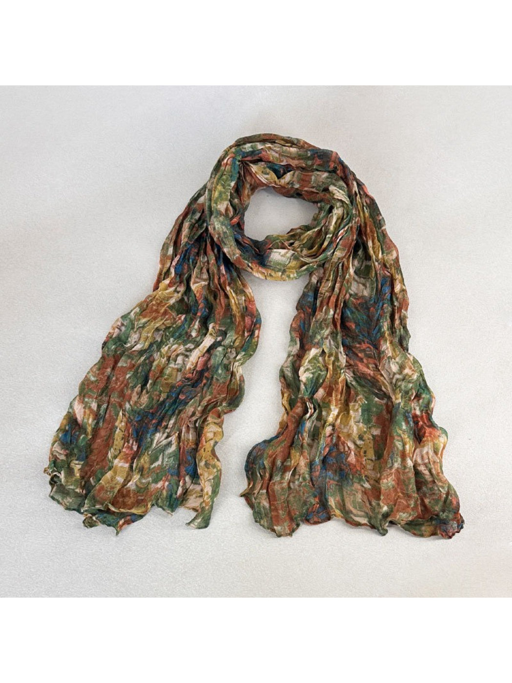 Flat lay of Scarvii scarf spread out to display the entire textured painterly pattern