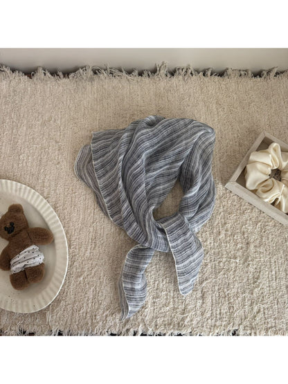 Striped bandana scarf styled as a headband on model