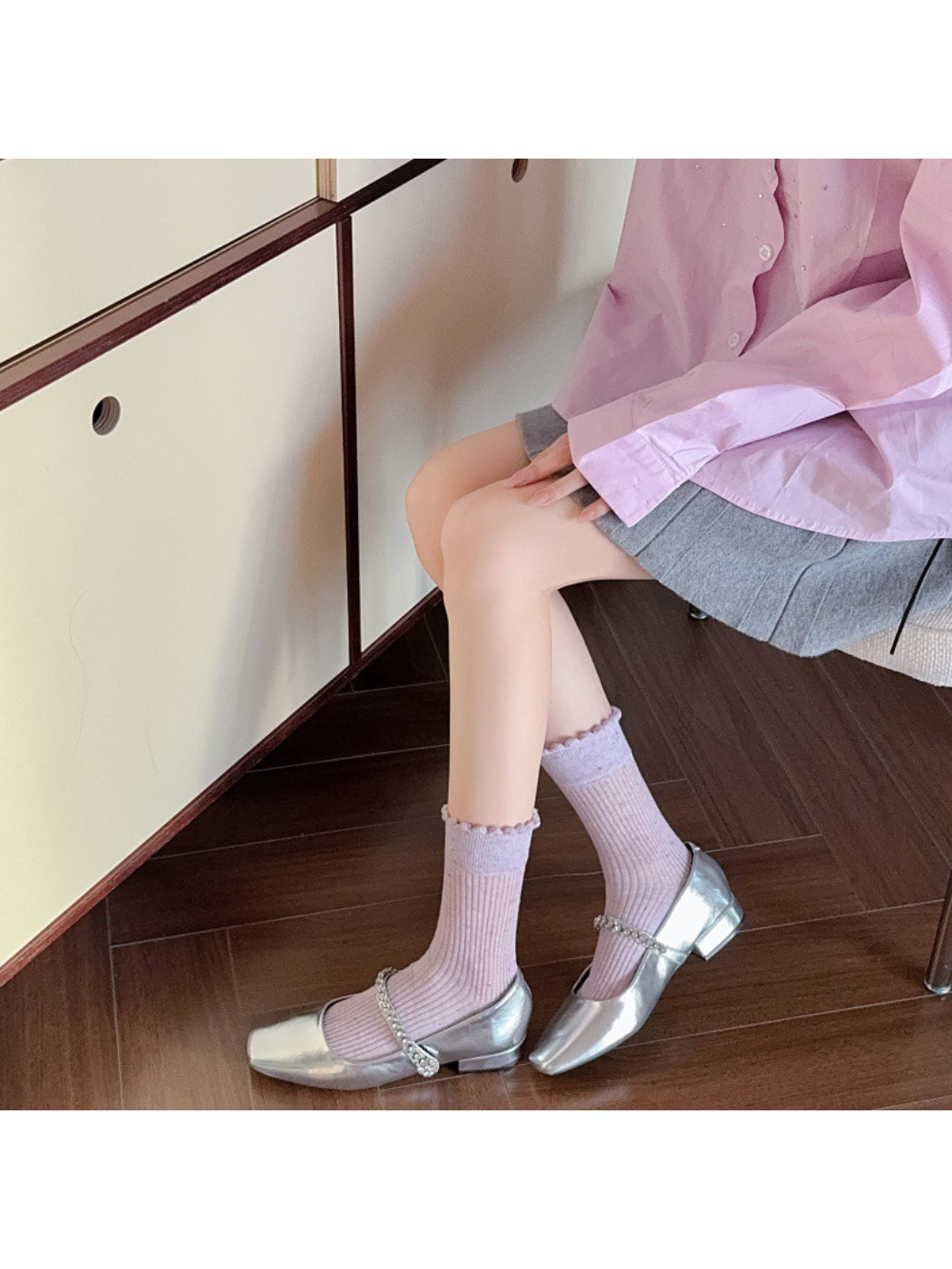 Pair of Rufia rib crew socks laid flat highlighting speckled knit detail