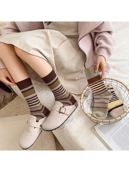 Pair of Rufia crew socks laid flat highlighting colorblock sections and bows