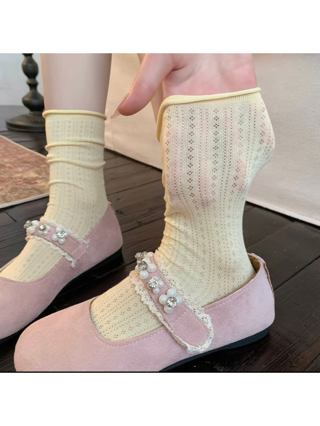Side view of Rufia ribbed mid-calf socks highlighting ribbed pattern