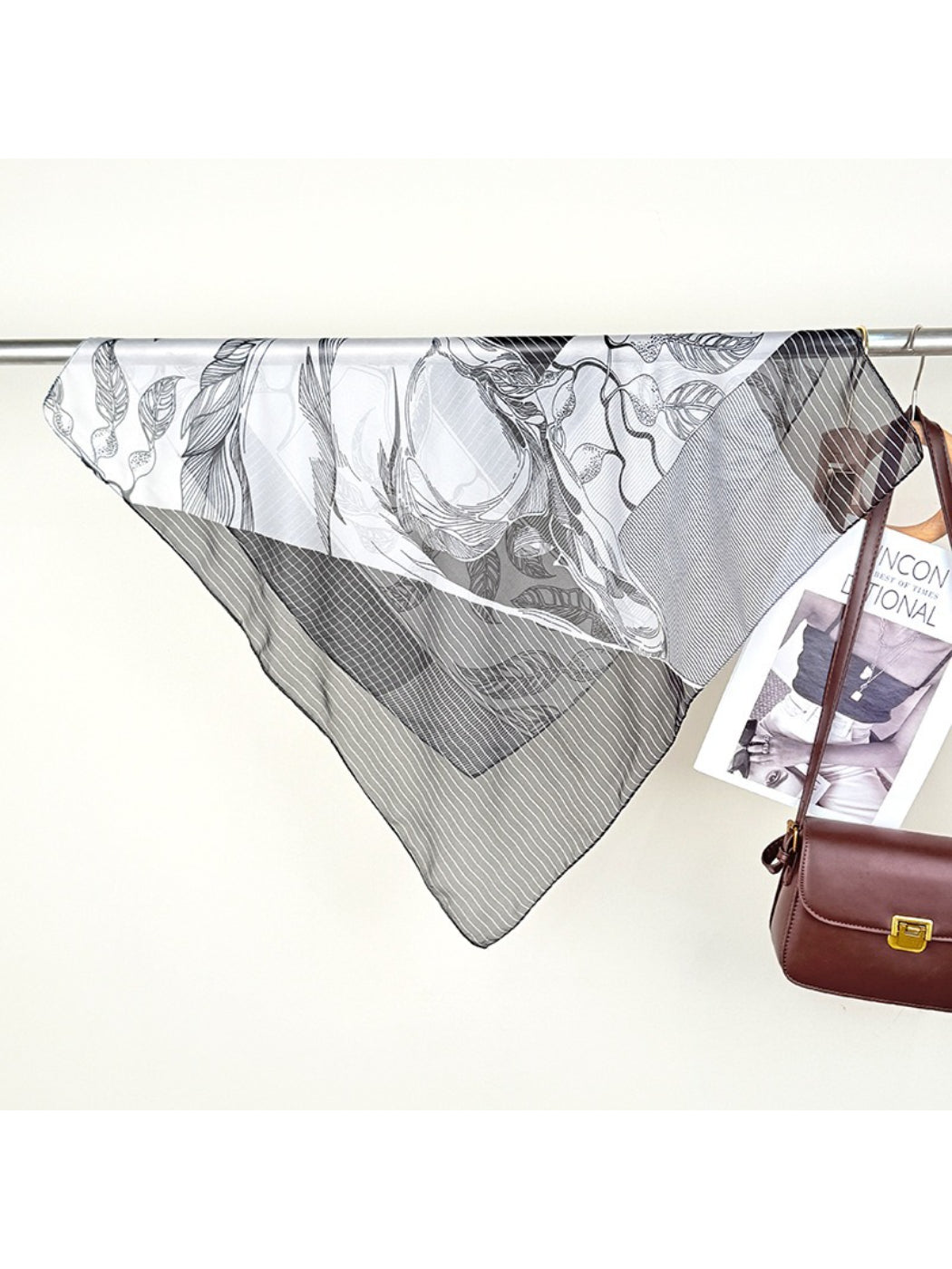 Model wearing Scarvii Abstract Line Square Scarf styled around the neck with abstract line pattern