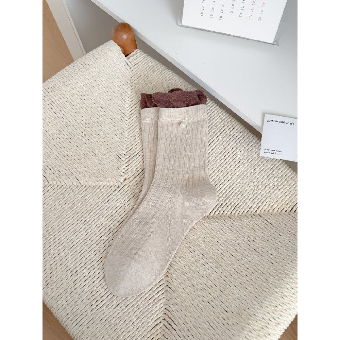 Rufia ribbed crew socks folded to show ruffle detail and texture