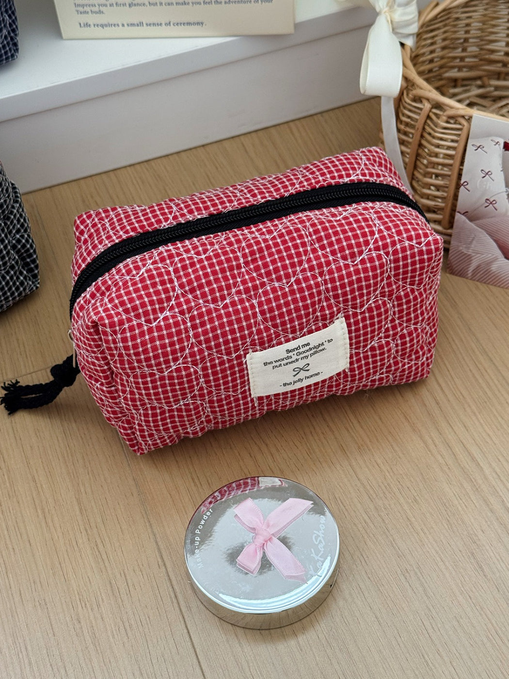 Top view of Cosbai quilted check toiletry bag partially open