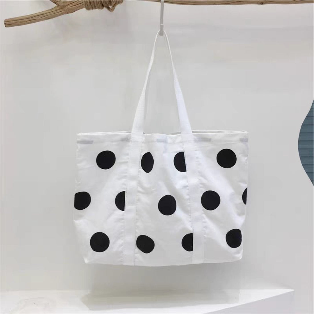 Side view of Cosbai Bold Dot Print shopper tote bag highlighting its shape and dot pattern