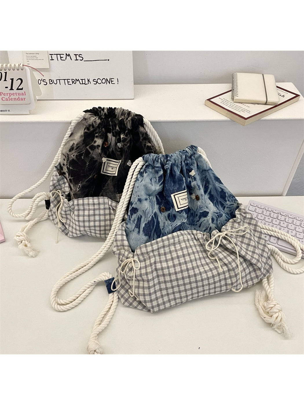 Close-up of Cosbai backpack's patchwork design and drawstring closure detail