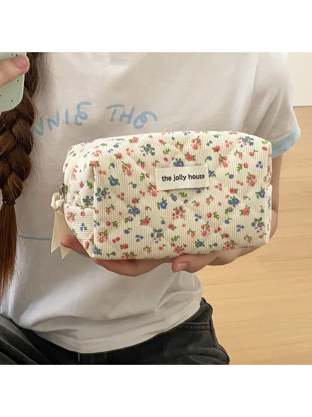 Close-up of floral pattern on Cosbai soft corduroy toiletry bag showing fabric texture