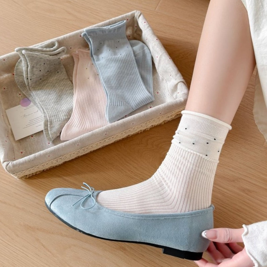 Side view of beige Rufia Everyday Turn Cuff Knit Socks showing ribbed knit pattern