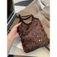 Cosbai chocolate sequin mini handbag shown open with interior lining visible