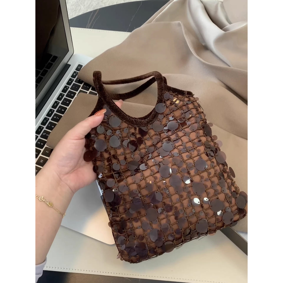 Cosbai chocolate sequin mini handbag shown open with interior lining visible