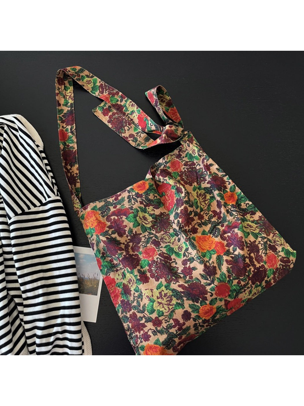 Close-up of Cosbai Painterly Rose Slouch Tote handle and fabric texture with rose design