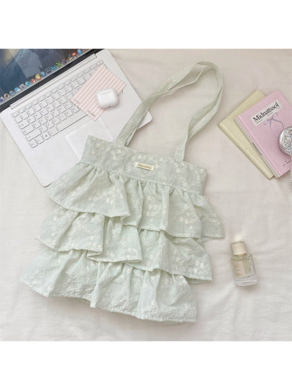 Cosbai Romantic Tiered Ruffle Tote Bag displayed on a flat surface