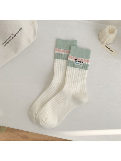 Rufia socks folded neatly, emphasizing stripe pattern and ribbed cuff detail