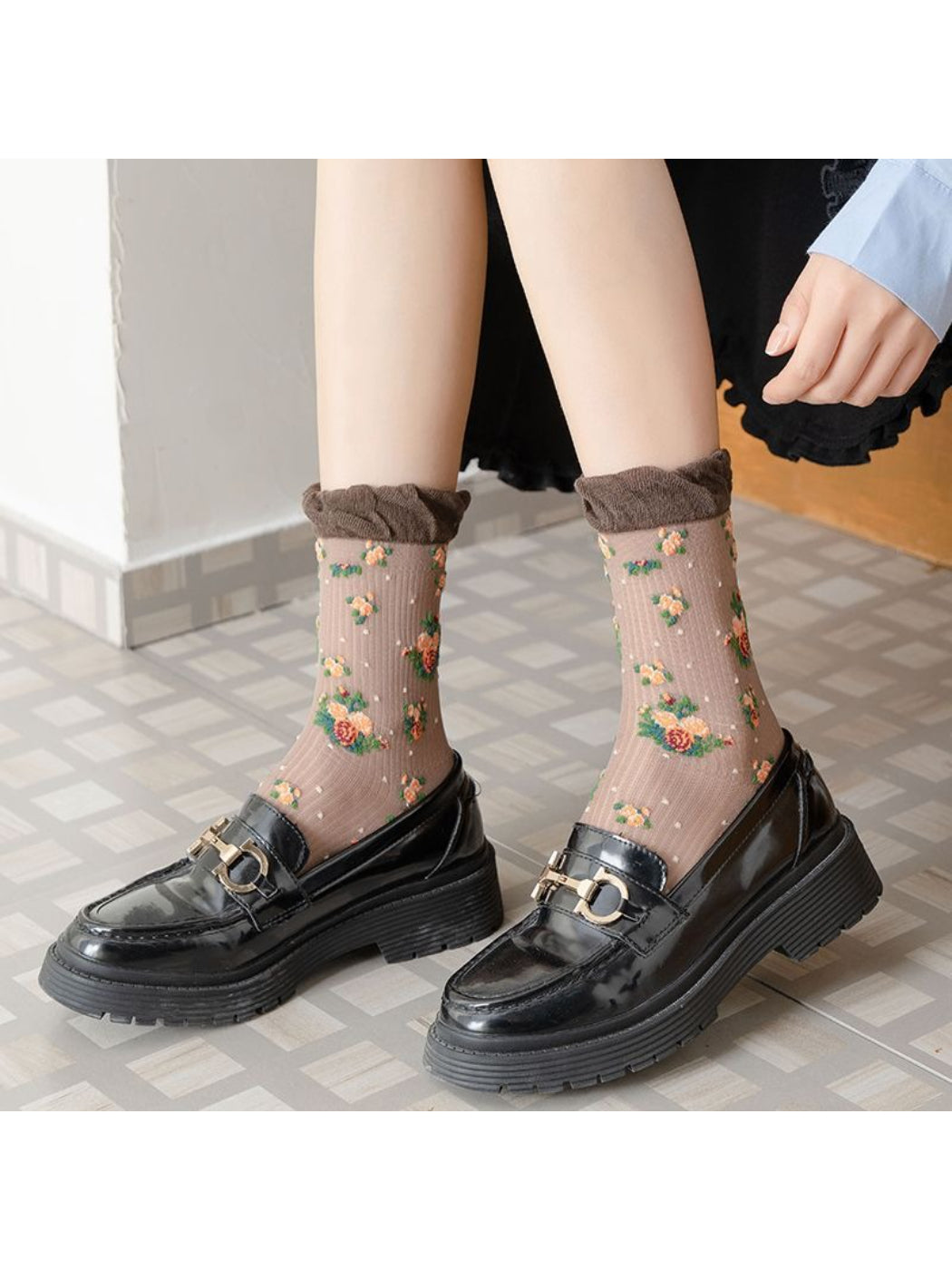 Close-up of Rufia crew socks featuring detailed vintage rose floral pattern