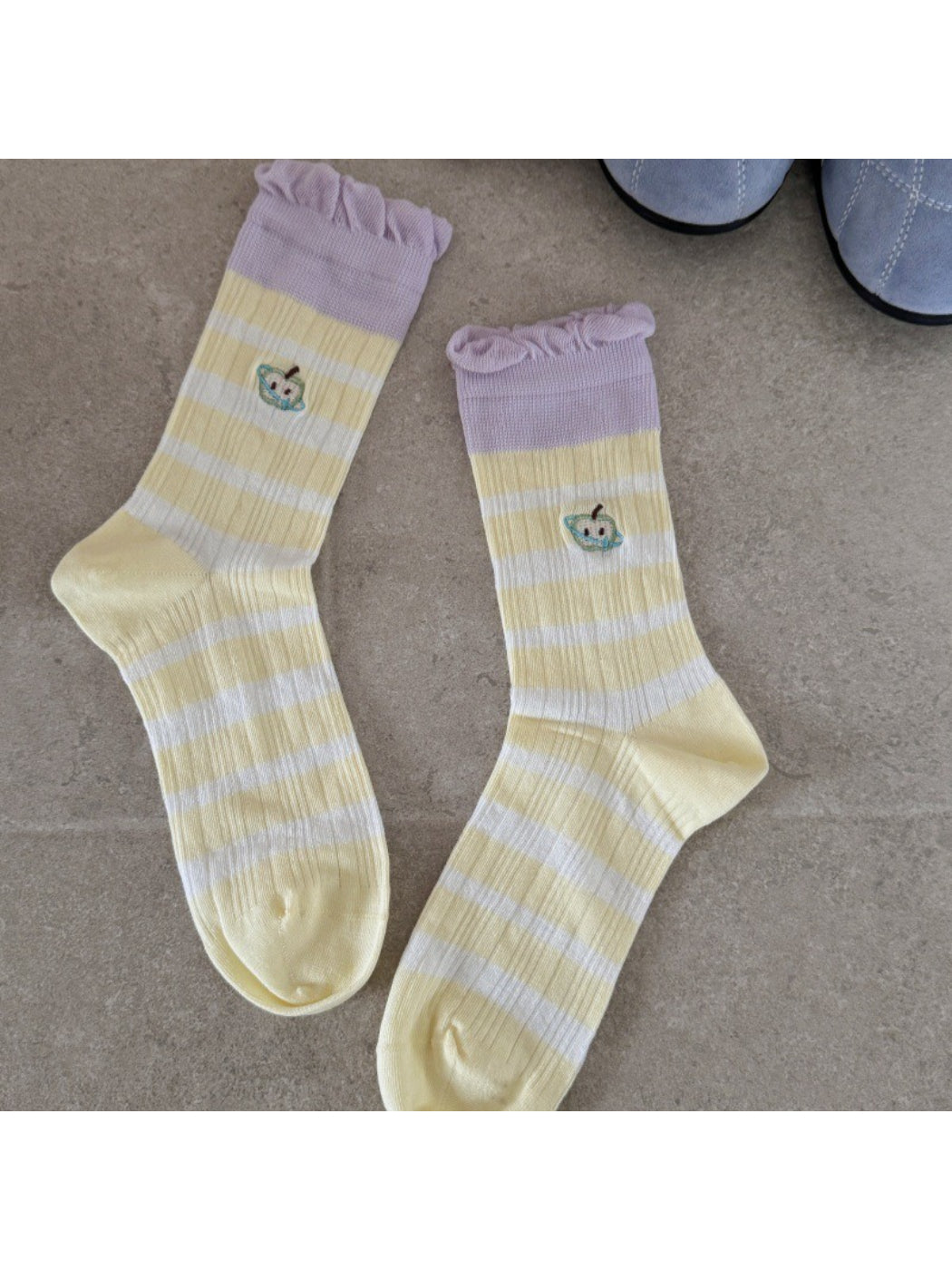 Rufia mid-calf socks worn on both feet with visible lace embroidery and mesh texture