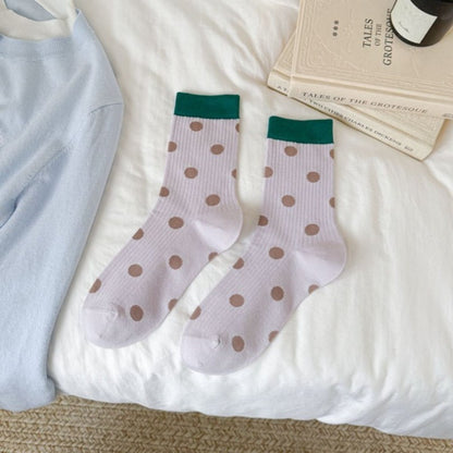 Rufia mid-calf socks folded to display dot pattern and color block contrast