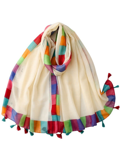 Close-up of Scarvii scarf tassels with multicolored rainbow border detail