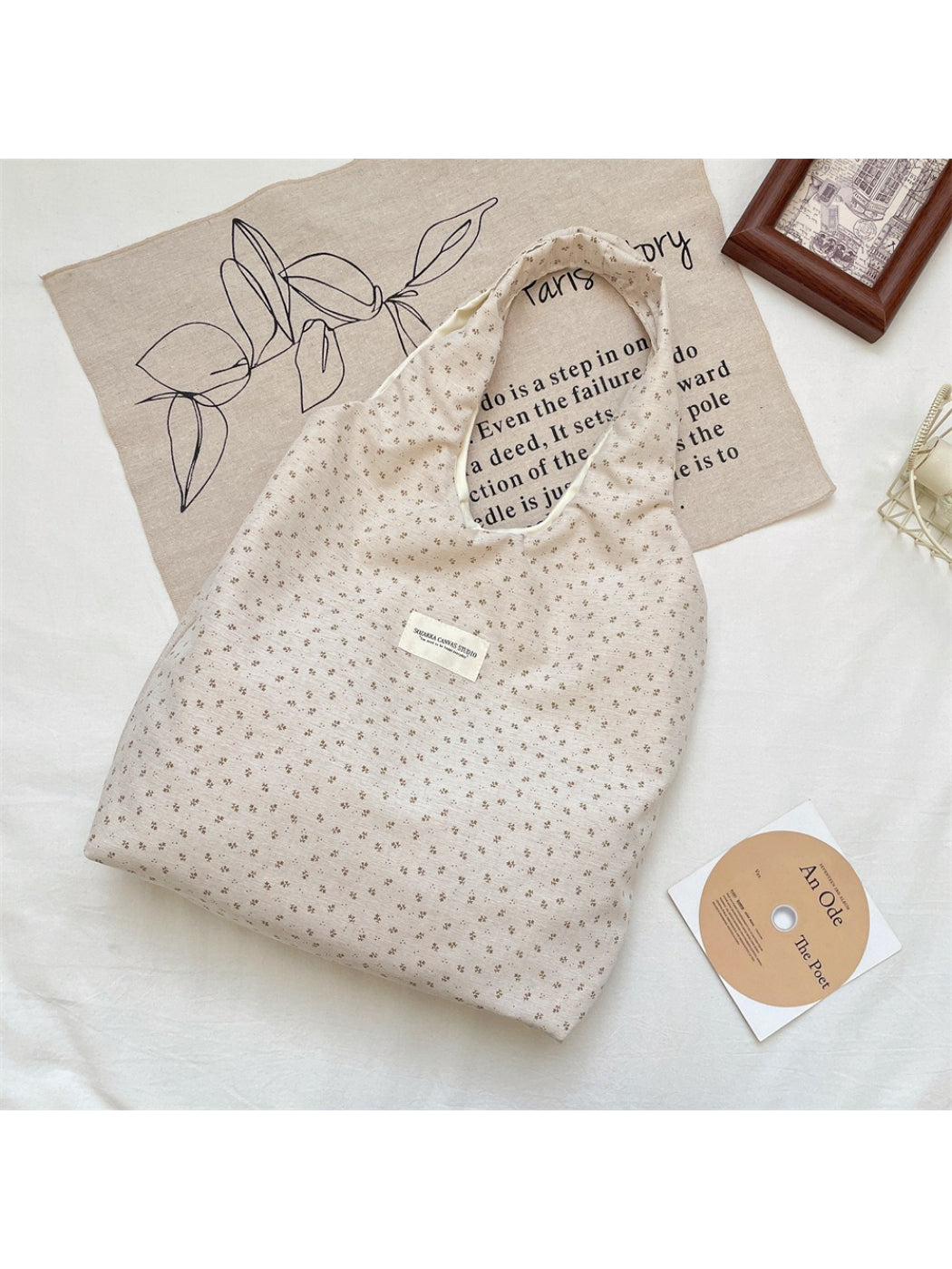 Side view of Cosbai Tiny Floral Slouch Tote Bag showing slouchy shape and floral design