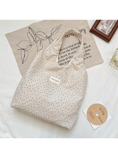 Side view of Cosbai Tiny Floral Slouch Tote Bag showing slouchy shape and floral design