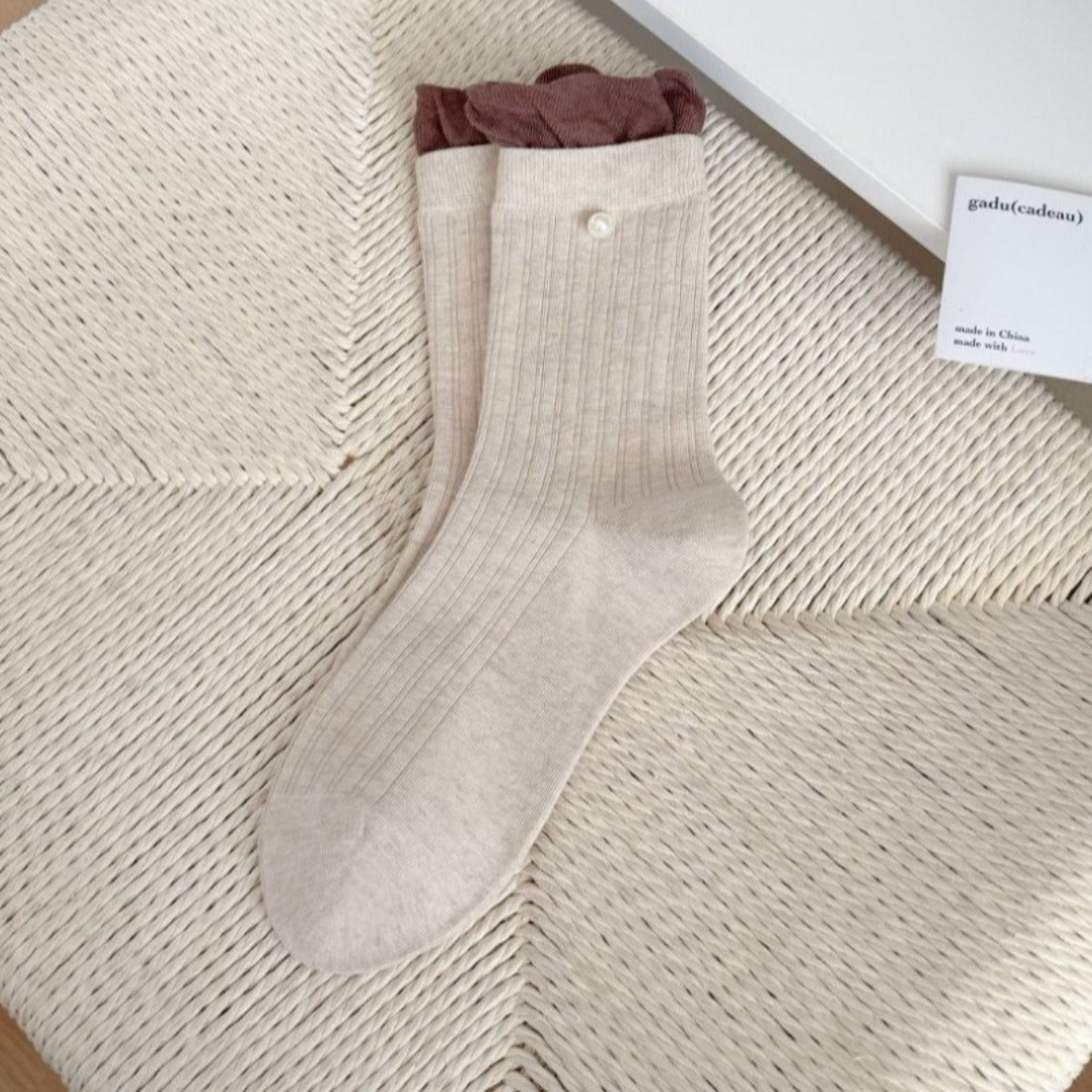 Rufia ribbed crew socks in light pink with ruffle detail on ankle