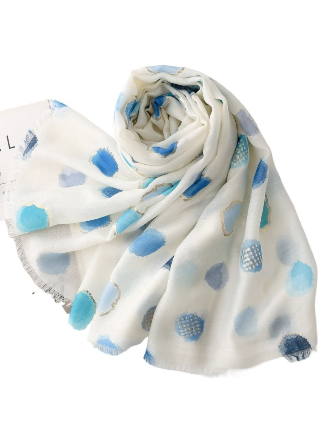 Scarvii scarf laid flat highlighting its airy, lightweight texture and dot pattern