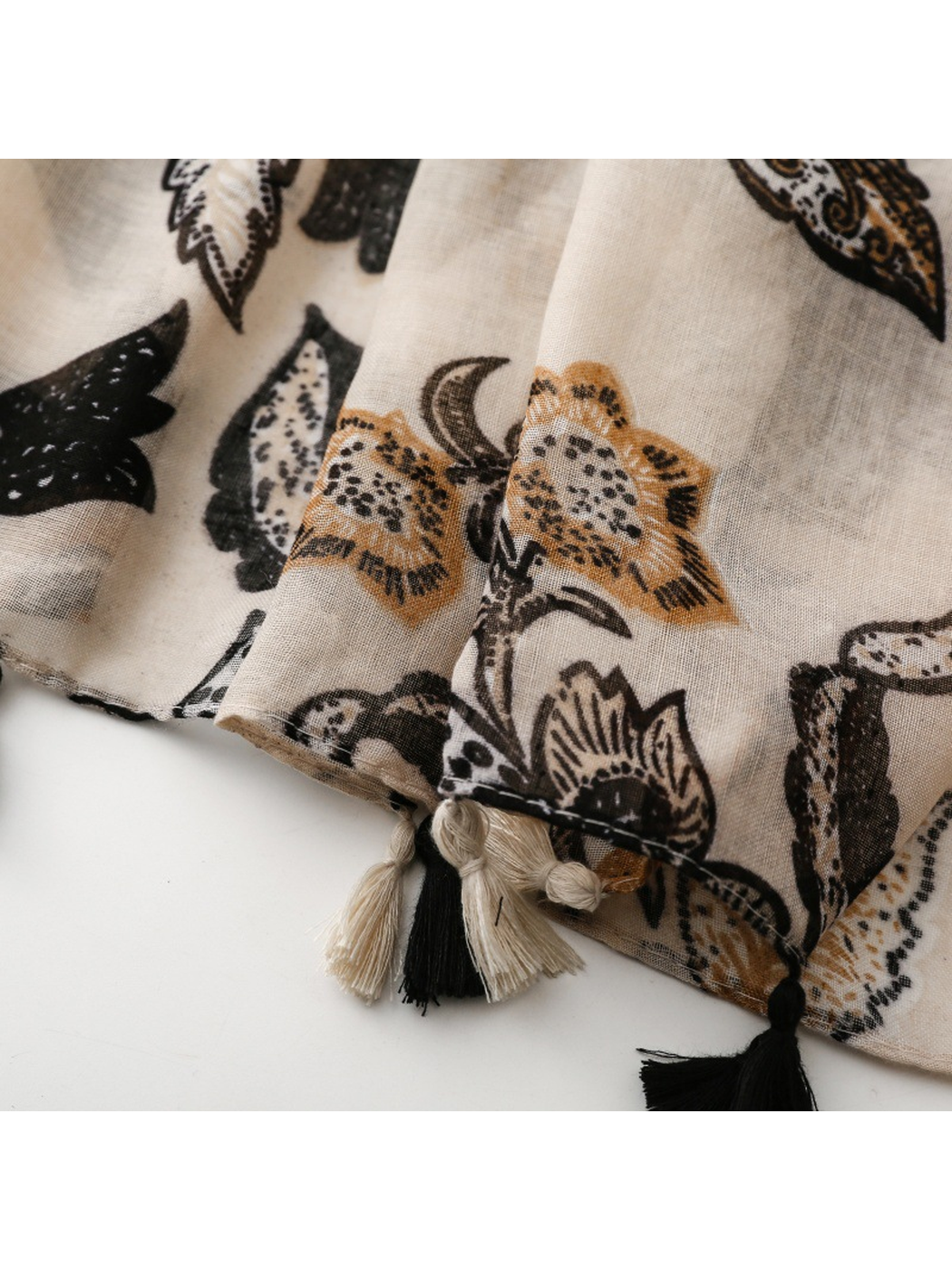Ivory black botanical scarf tassel detail
