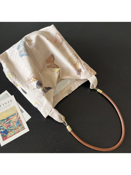 Cosbai soft tote bag with colorful butterfly print on light fabric
