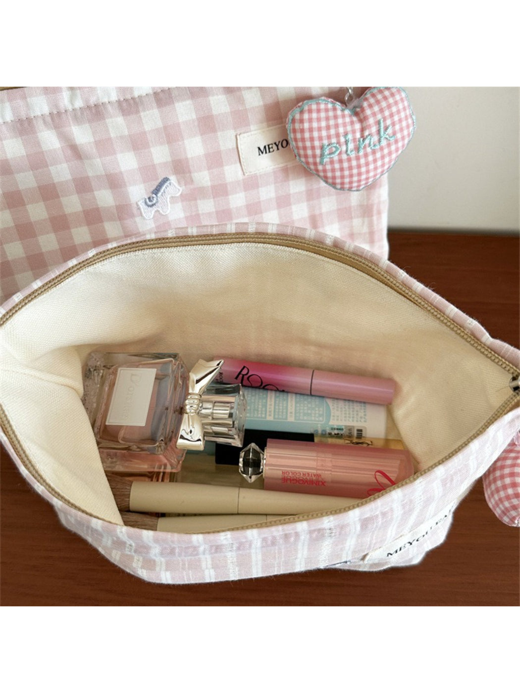 Cosbai gingham pink makeup pouch with brand label visible on side
