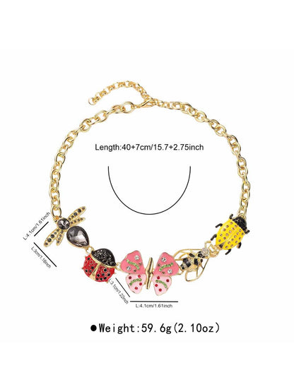 Model wearing Neckit Butterfly & Bug Charm Necklace with butterfly and bug charms visible