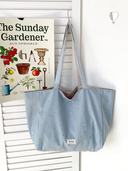 Cosbai Star Print Tote bag folded flat to display lightweight and flexible material