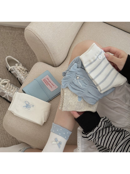 Pair of Rufia crew socks with ruffle detail in soft pastel pink