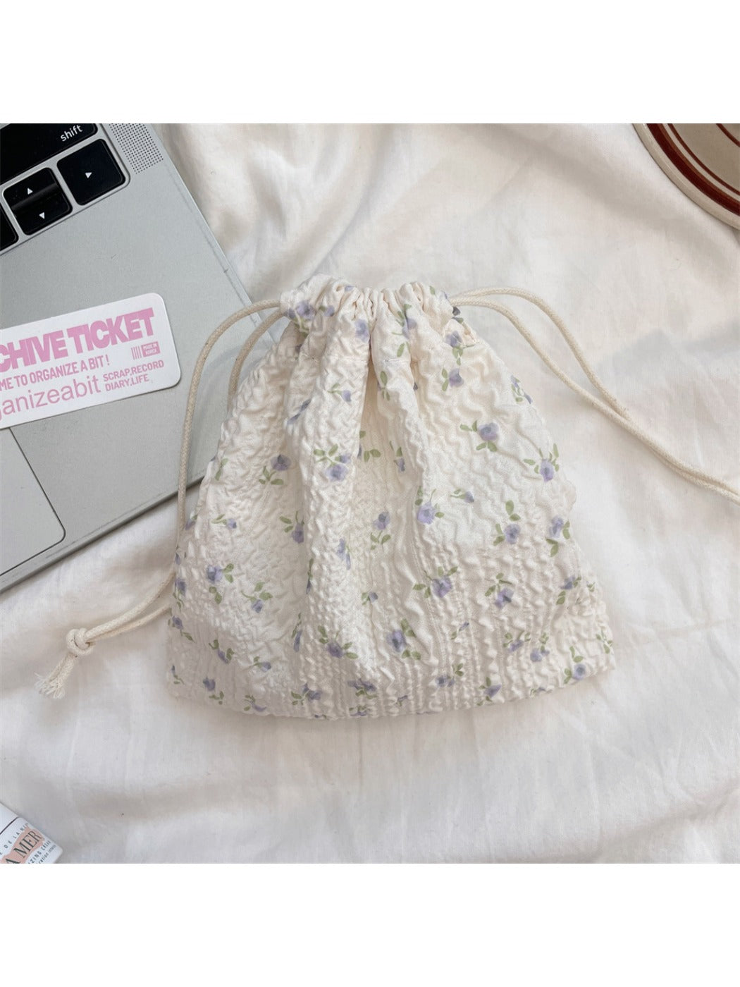 Cosbai cartoon drawstring pouch shown from top view with drawstrings extended
