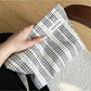 Cosbai makeup pouch featuring a gingham pattern and bow accent