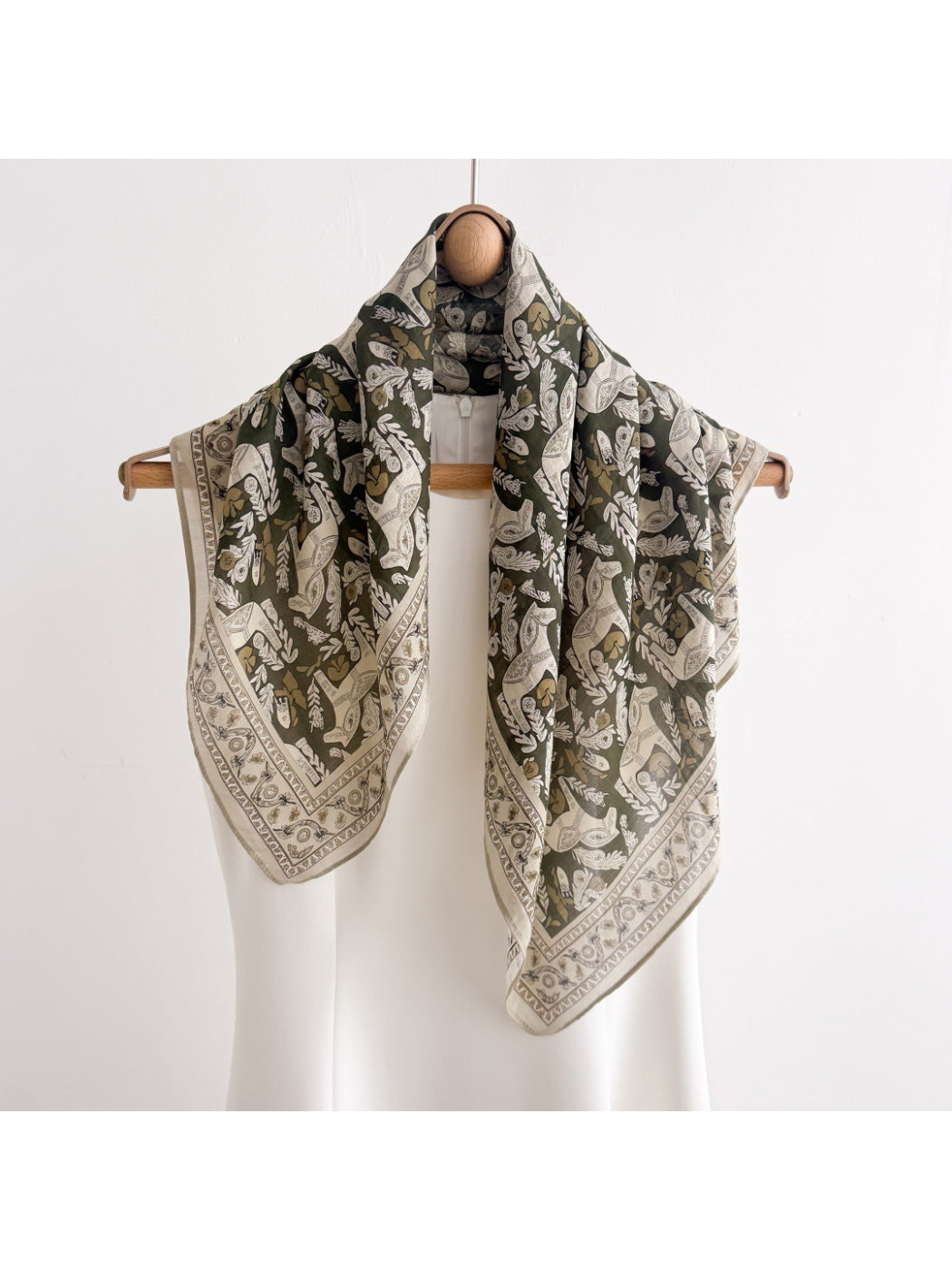 Scarvii Botanical Illustration Square Scarf folded showing floral and leaf patterns