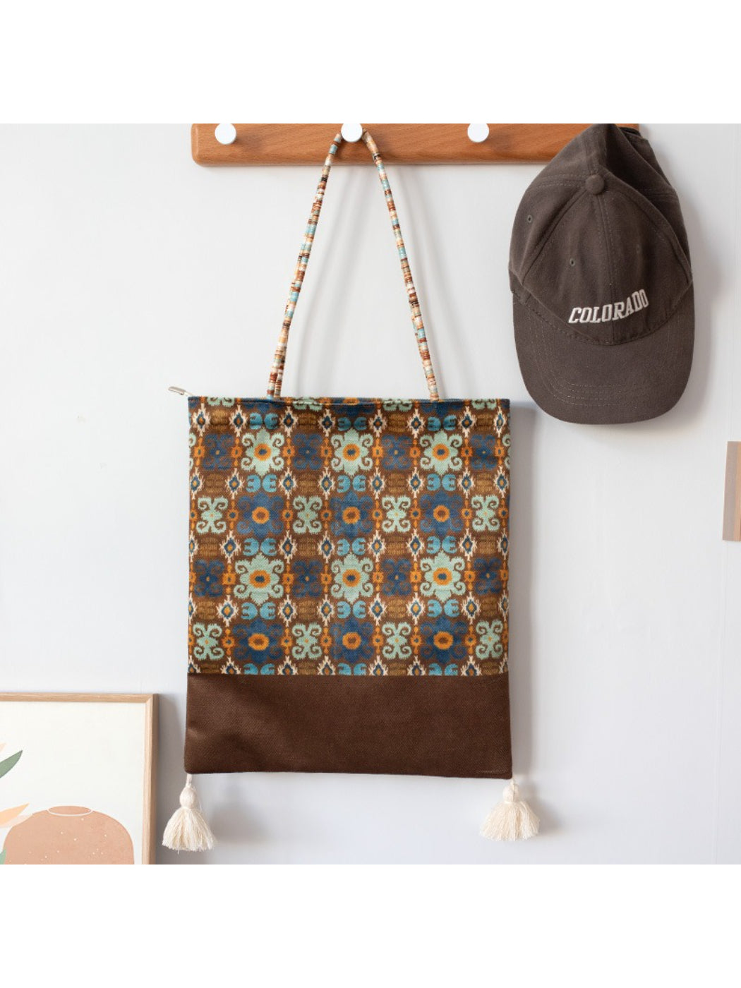 Cosbai Boho Ethnic Tassel Tote held by hand showing size and tassel details