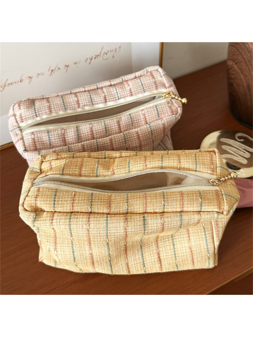 Close-up of Cosbai pastel plaid cosmetic bag showing fabric texture and pattern