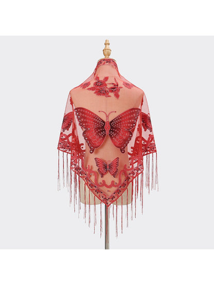 Model styling Scarvii Butterfly Fringe Triangle Scarf as a head wrap with butterfly pattern visible